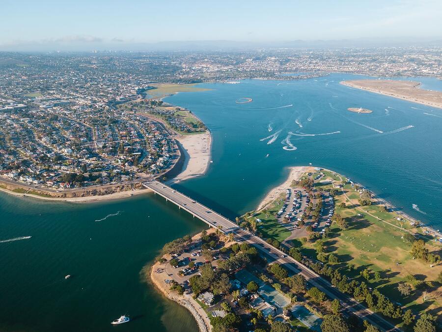 Aerial view of waterfront homes on canals and a bay